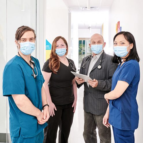 A group of Santé Cannabis's health care professionals and doctors standing together as a clinical team