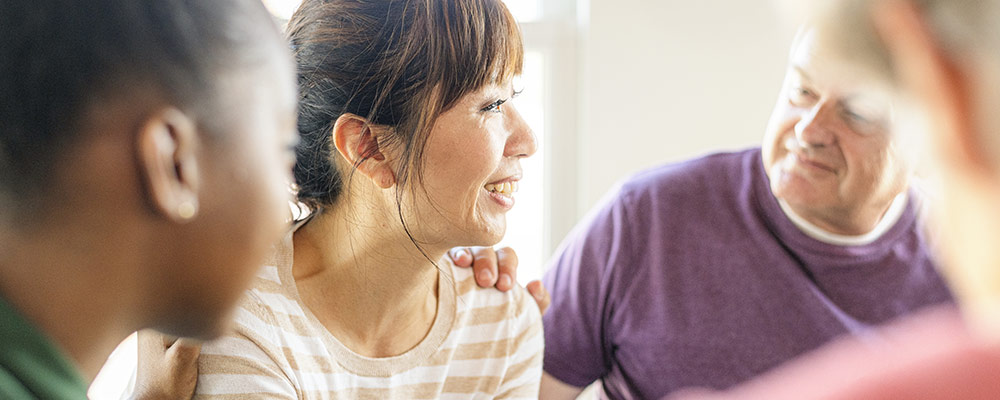 Person getting help in a support group setting