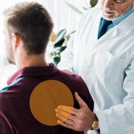 Doctor checking patient in pain