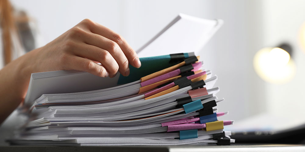 Person looking through documents of evidence