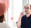 A Santé Cannabis nurse teaching a patient how to use the vape for cannabis