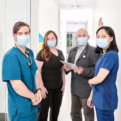 A group of Santé Cannabis's health care professionals and doctors standing together as a clinical team